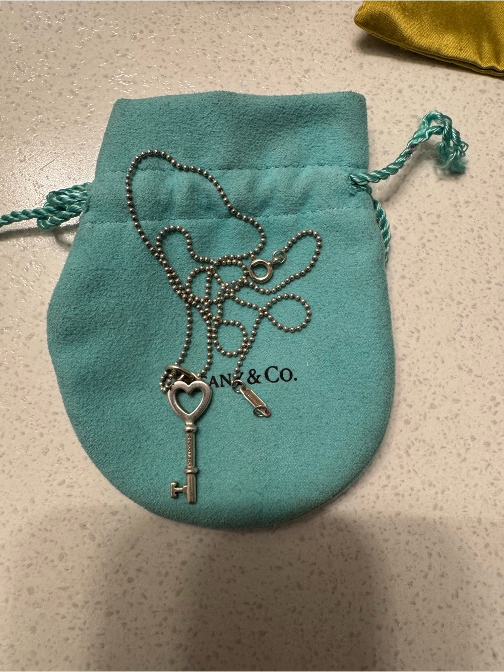 Tiffany & Co. Silver Heart Key Necklace with Blue Pouch